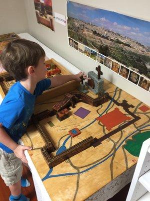 The Atrium:  A special place where the children learn about Jesus.  Here the child puts together Jerusalem as it was when Jesus walked there