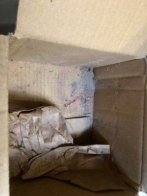 The box is full of powder from broken bombs.