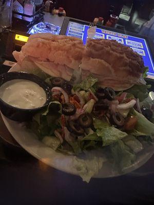 Not sure what they called it but it was a turkey sandwich on a Dutch crunch roll it was absolutely delicious and the salad was so yummy