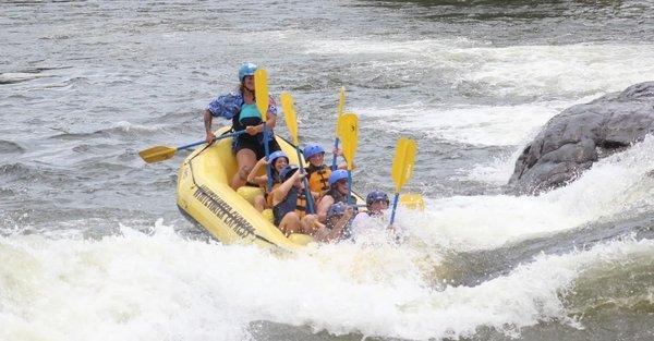 Putting in the extra time and effort to give us a great rafting experience! This was 1 of 3 attempts at 'surfing' this particular spot.