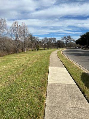 Paved trail that runs along the road