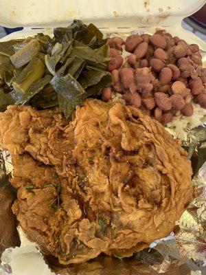 Fried pork chop meal with collard greens and Red Beans and Rice