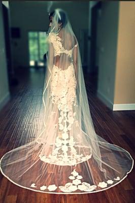 Custom design bridal sculptural lace-on-net gown and veil