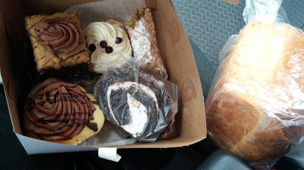 German chocolate cake,  chocolate cream pie, cannoli, Boston cream cupcake and a Swiss roll.