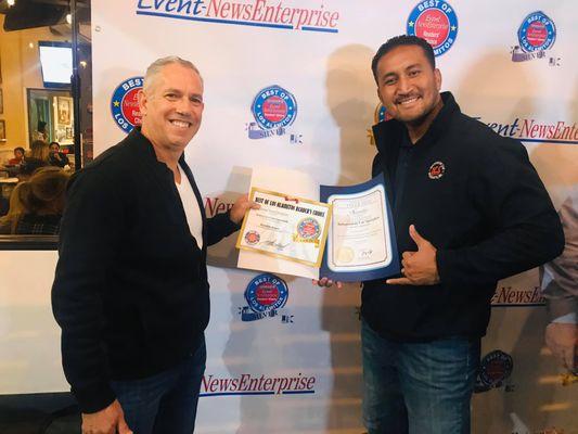 Tony & Peleti receiving award for Best Auto Repair in Los Alamitos, CA