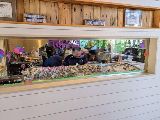 Inside. Daily oyster selection on display between entrance and dining room. Open kitchen.