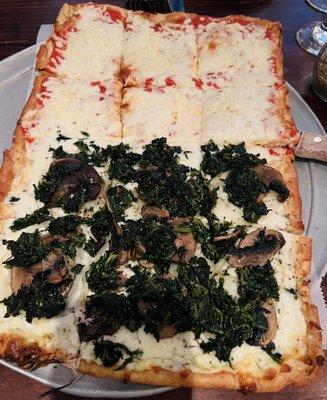 Thin crust, half red and half white with spinach and mushrooms.