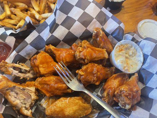 AMAZING Buffalo wings with homemade blue cheese dipping sauce and Cajun fries.