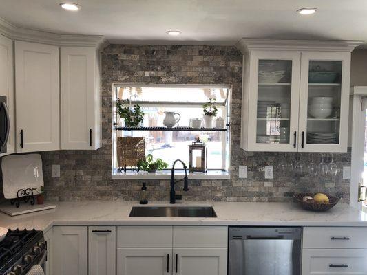 He cut and mounted or under-mount sink and the hole for the faucet.