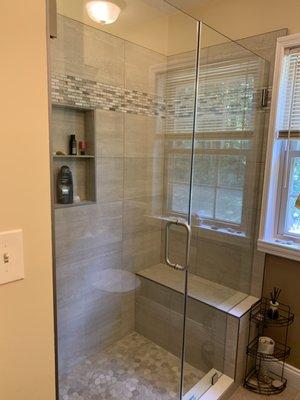 Bathroom tile with frameless glass door