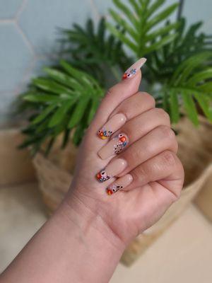 This was my most recent nail design I wanted. I was hoping for a Frida Khalo inspired look and Mary gave me just that.