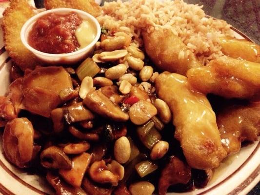 Lemon chicken dinner plate with fried shrimp.