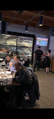 Dining area surrounded by fine car storage