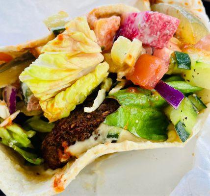 Falafel greatness. Make sure to get hummus, hot sauce, pickles, and radishes INSIDE.