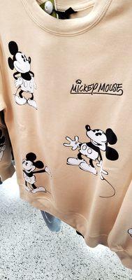 Tan Mickey Mouse sweatshirt.