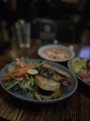 Short rib grilled cheese sandwich with side salad and tomato soup