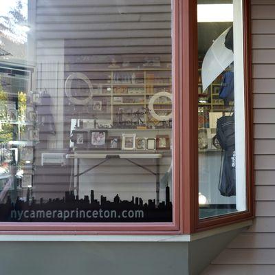 You'll pass our window as you walk up the stairs and enter our store.