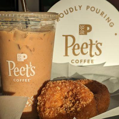 Iced chai latte with crumb cake and cinnamon sugar cake donut