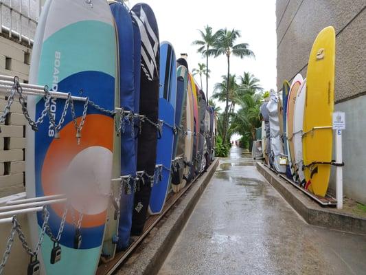 Boards stored in Nalu Storage racks just a spit from the beach