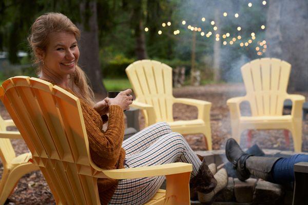 Julie takes a break by the bonfire