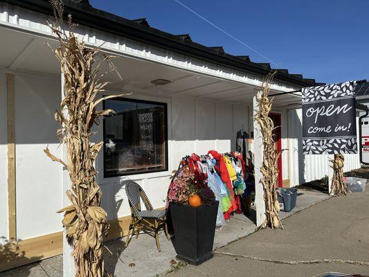 We repainted the exterior of the store white with a black roof in the summer of 2024.