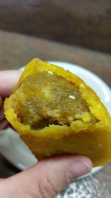 Empanada de Carni, a potato meat filling shown with salsa picante. Course ground Columbian corn masa. No words!!!