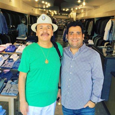 Loyal customer Carlos Santana w/ Mastroianni Fashions menswear consultant.