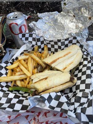 Cheesesteak, seasoned fries, and a Diet Coke.