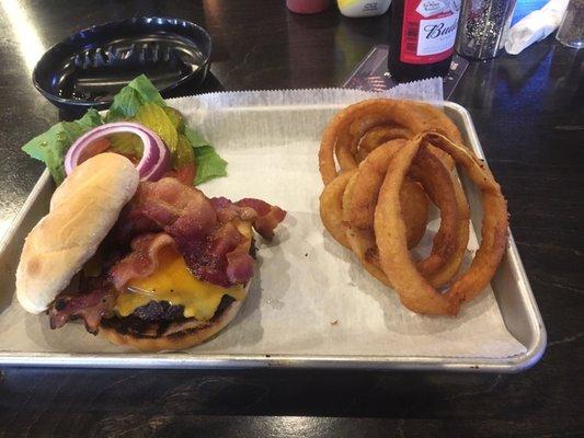 Bacon cheddar burger with onion rings.