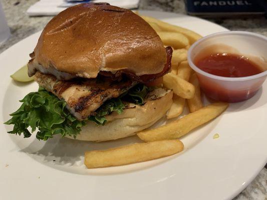 Delicious Grilled Chicken Sandwich with crispy fries.