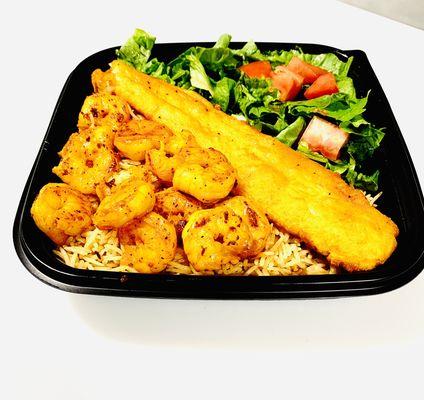 Grilled Shrimp and fish over rice and salad.