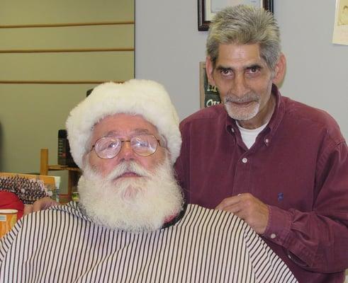 Gary cutting Santa's hair. Getting him ready for Christmas.