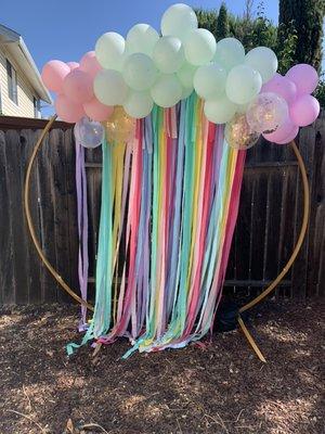 Metal arch, streamers, balloon garland