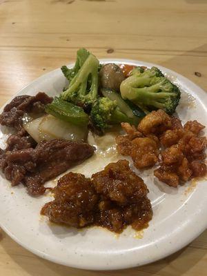 Steamed vegetables, orange chicken, seasame chicken, and general tso chicken