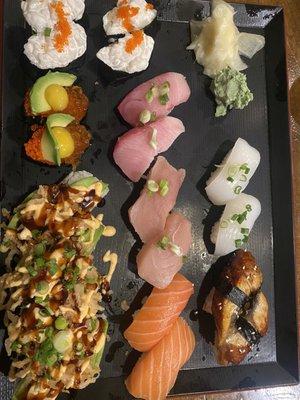 Left: Creamy scallop, snake eyes (quail egg, salmon eggs, tobiko), kari kari Middle: yellowtail, albacore, salmon Right: Squid, unagi