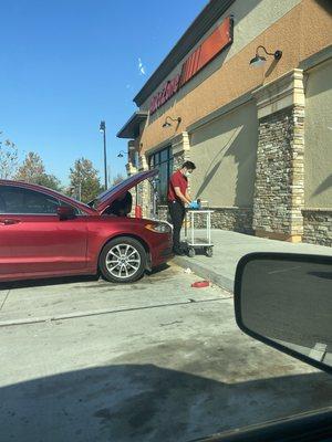 Unhelpful employee and trash in the parking lot (no garbage cans)