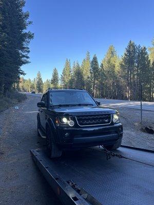 LR4 being towed from Tahoe to 11th Street .