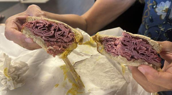 Now thats a sandwich! Pastrami piled generously on fresh Marble rye bread.