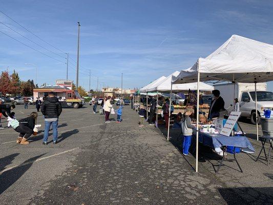 Some vendors and a taco truck