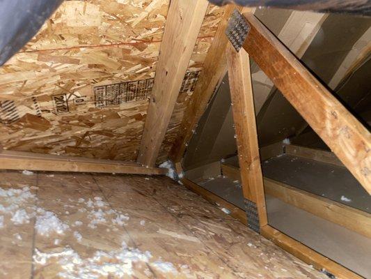 Attic with no insulation.