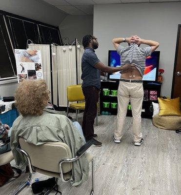 Dr. Hubbard patching a clients back issue at our meet up at Feel The Freedom.