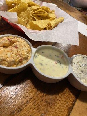 Tortilla Chips and Trio of Pimento Cheese, Queso, Artichoke Dip.