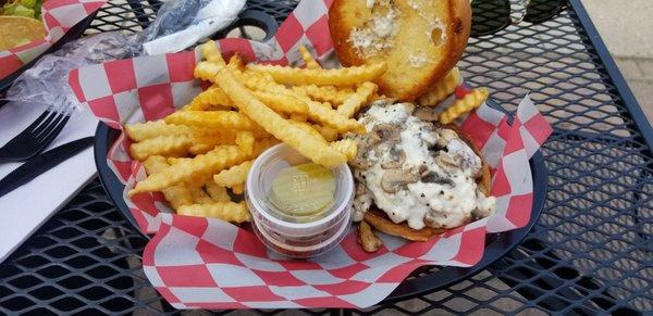 Burger tasted better than it looks here but fries were cold and patty was well overcooked.