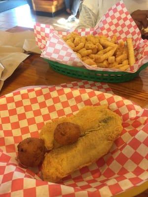 shrimp platter - popcorn shrimp, fish (tilapia), hush puppies and fries.