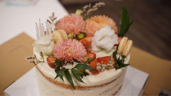 Lemon buttercream vanilla cake with fresh blueberries and strawberries + bonus macarons!