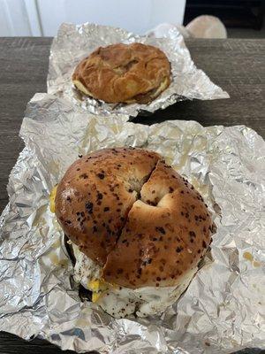 Sausage egg and cheese bagel and a sausage egg and cheese croissant