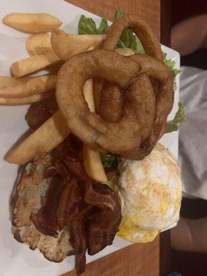 Hangover burger with fries and onion rings on an English muffin