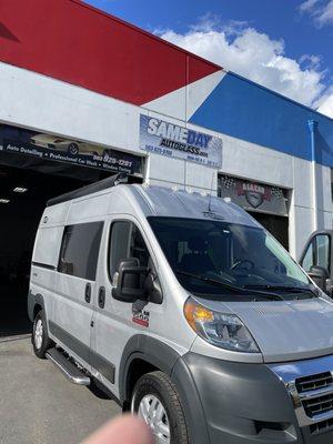 Van in front of shop