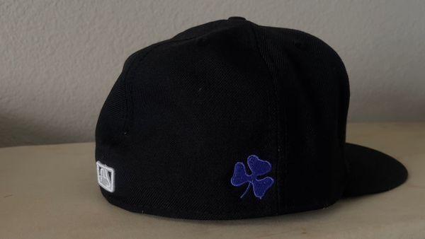 Embroidered fitted cap with purple shamrock