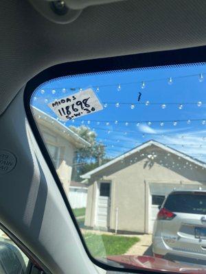 Handmade mileage next service sticker and stroke of sharpie on my windshield